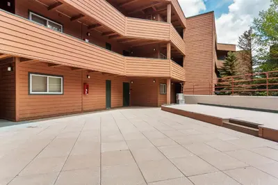 a house with a large driveway in front of it at Marina Place 115 by Great Western Lodging in Dillon
