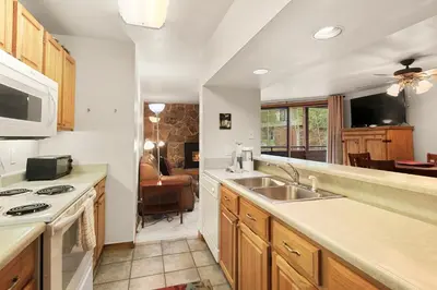 a kitchen with a sink and a stove at Marina Place 115 by Great Western Lodging in Dillon
