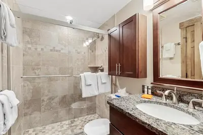 a bathroom with a sink and a toilet and a shower at Mountain View Getaway by Great Western Lodging in Frisco