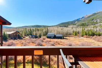a view from the deck of a cabin with a mountain at Mountain View Getaway by Great Western Lodging in Frisco