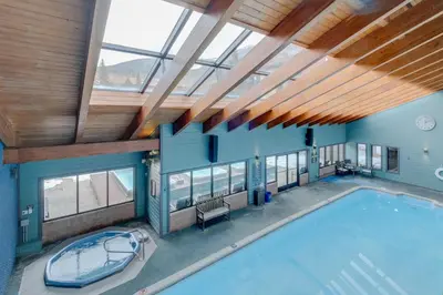 an overhead view of a swimming pool in a house with windows at Mountainside B173 by Great Western Lodging in Frisco