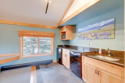 a kitchen with a sink and a window at Mountainside B173 by Great Western Lodging in Frisco