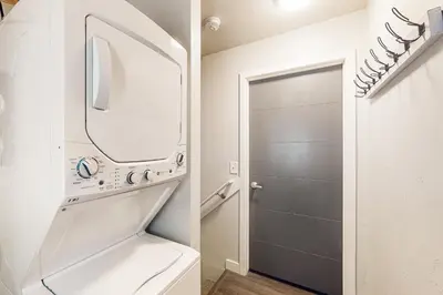 a bathroom with a sink and a mirror at Easy Commuting! Renovated Greeley Apartment in Greeley