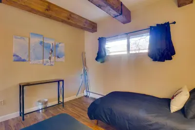 a bedroom with a bed and a window at Ten Mile Creek 115 by Great Western Lodging in Frisco