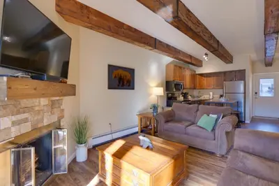 a living room with a couch and a fireplace at Ten Mile Creek 115 by Great Western Lodging in Frisco