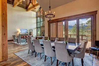 a dining room with a table and chairs at The Observatory by Great Western Lodging in Breckenridge