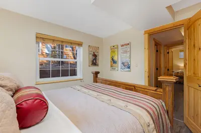 a bedroom with a bed and a window at Antlers Pointe 1 by Estes Park Condos in Estes Park