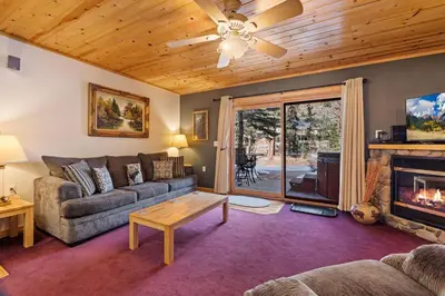 a living room with a couch and a fireplace at Bugle Pointe B10 by Estes Park Condos in Estes Park