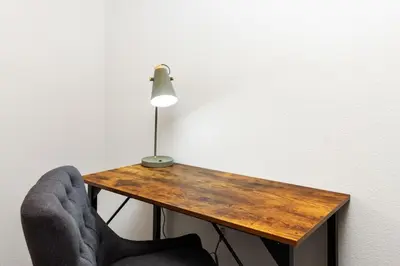 a lamp and a desk with a chair and a lamp on it at Bugle Pointe B12 by Estes Park Condos in Estes Park