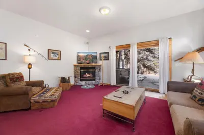 a living room filled with furniture and a fireplace at Bugle Pointe A16 by Estes Park Condos in Estes Park