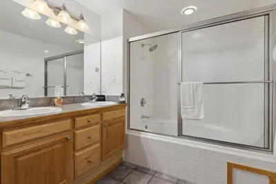 a bathroom with a shower and a sink at Bugle Pointe B14 by Estes Park Condos in Estes Park