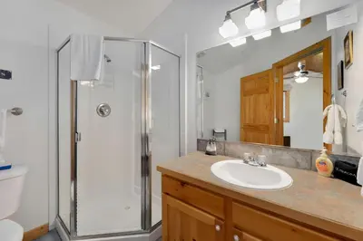 a bathroom with a sink and a shower at Bugle Pointe A03 by Estes Park Condos in Estes Park