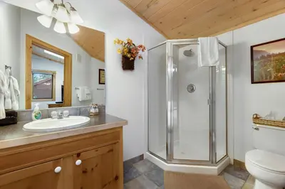 a bathroom with a shower and a sink at Bugle Pointe A09 by Estes Park Condos in Estes Park
