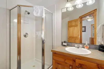 a bathroom with a sink and a shower at Bugle Pointe B11 by Estes Park Condos in Estes Park