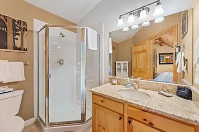 a bathroom with a shower and a sink and a toilet at Bugle Pointe A04 by Estes Park Condos in Estes Park