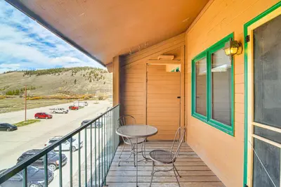 a porch with a table and chairs on a balcony at Hot Tub and Indoor Pool Access at Granby Condo in Granby
