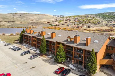 an aerial view of a building with a parking lot at Hot Tub and Indoor Pool Access at Granby Condo in Granby