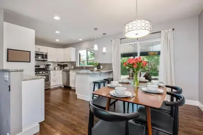a kitchen and dining room with a table and chairs at Mid-Mod Marvel Central Game RmWet Bar Patio in Arvada
