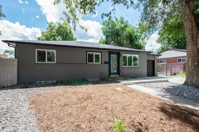 a home with a driveway and a house at Mid-Mod Marvel Central Game RmWet Bar Patio in Arvada