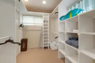 a room with white shelves and a bed in it at Arvada home w hot tub & BBQ in Arvada