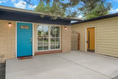 a front door of a house with a blue door at Arvada home w hot tub & BBQ in Arvada