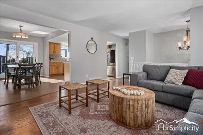 a living room with a couch and a table at Spacious home w game room & firepit in Arvada