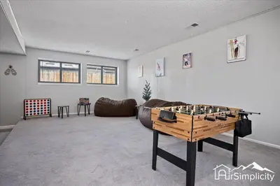 a living room with a large chess board on a table at Spacious home w game room & firepit in Arvada