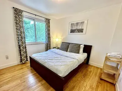 a bedroom with a bed and a window at Group-Friendly 4-Bedroom Denver Home w Backyard in Centennial