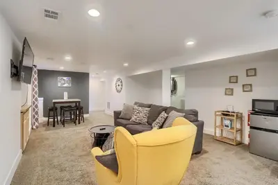 a living room with a couch and a table at Group-Friendly 4-Bedroom Denver Home w Backyard in Centennial