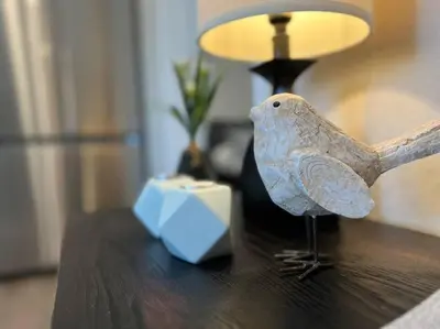 a figurine of a bird sitting on top of a table at Chic & intimate 2 bedroom in Brighton
