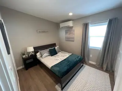 a bedroom with a bed and a window at Chic & intimate 2 bedroom in Brighton