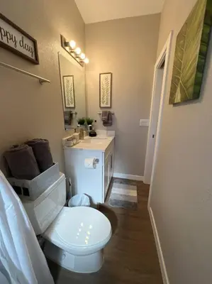a bathroom with a white toilet and a sink at Chic & intimate 2 bedroom in Brighton