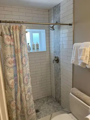 a bathroom with a shower with a shower curtain at Cozy 1 bedroom in the heart of Brighton in Brighton