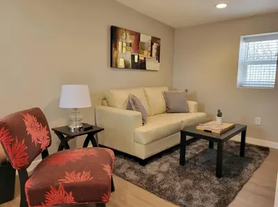 a living room with a couch and two chairs at Calm and relaxing 1 bed in Brighton
