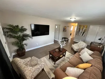 a living room with a couch and a table at Spacious Westminster 2bd/1ba in Westminster