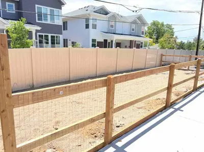 a wooden fence in front of a house at Spacious Westminster 2bd/1ba in Westminster