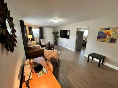 a living room with a couch and a table at Spacious Westminster 2bd/1ba in Westminster