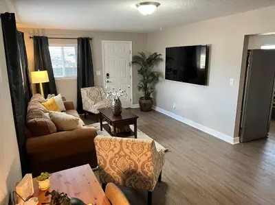 a living room with a couch and a table at Spacious Westminster 2bd/1ba in Westminster
