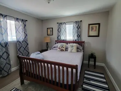 a bedroom with a bed and two windows at Peaceful 2 bed in Westminster in Westminster