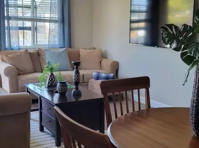 a living room with a table and a couch at Peaceful 2 bed in Westminster in Westminster