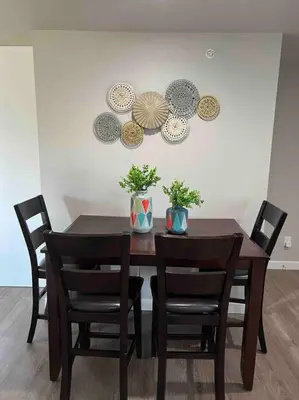 a dining room table with chairs and plates on the wall at Charming 2 bed in Westminster in Westminster