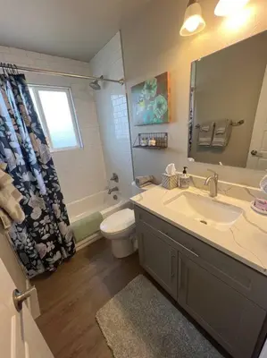 a bathroom with a sink and a toilet and a mirror at Charming 2 bed in Westminster in Westminster
