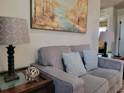 a living room with a couch and a painting on the wall at Charming 2 bed in Westminster in Westminster