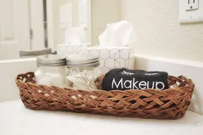 a basket sitting on a bathroom counter withason jars at Cozy 3 bedroom in Westminster in Westminster