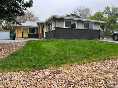 a house with a green lawn in front of it at Cozy 3 bedroom in Westminster in Westminster