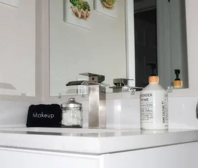 a bathroom counter with a sink with a mirror at Modern 2 bed in Westminster in Westminster