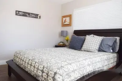 a bedroom with a large bed with a white wall at Modern 2 bed in Westminster in Westminster