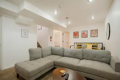 a living room with a couch and a table at Cozy Getaway Retreat - 4BR - Northglenn in Northglenn