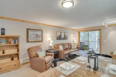 a living room with a table and chairs at Convenient Winter Park Condo - 3 Mi to Resort! in Winter Park