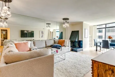 a living room with a couch and a table at Downtown Denver Condo in the Center of the City! in Denver